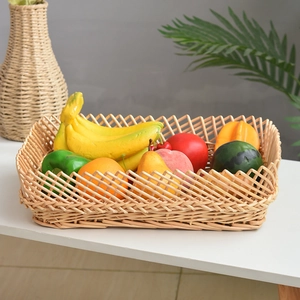 Rectangular hand-woven wicker basket filled with assorted fruits for home storage