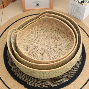 Detailed top view of three-piece cat-ear shaped hand-woven straw baskets for pets