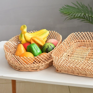 Set of 2 woven wicker baskets for fruits and home storage on a clean white desk