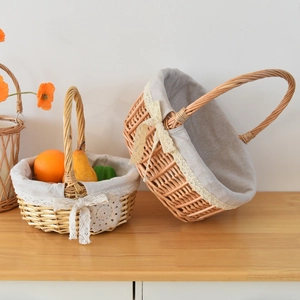 Detail of two woven wicker baskets with cotton lining and elegant lace ribbon trim