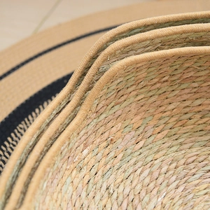 Close-up of durable hand-woven cat nest with natural fiber texture and brown fabric edging