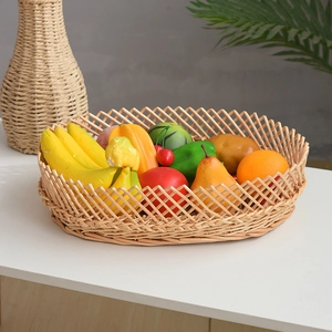 Macro detail of a hand-woven wicker fruit basket featuring realistic faux fruit models