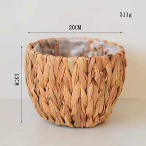 Detail view of woven seagrass planter featuring waterproof plastic lining and 20cm diameter