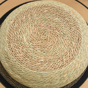 Macro shot of natural cattail woven cat bed showing hand-braided spiral texture