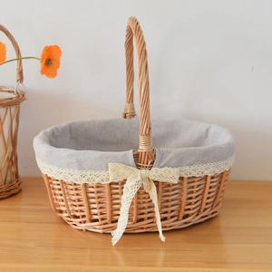 Detail of hand-woven wicker basket with grey linen liner and delicate lace bow decoration