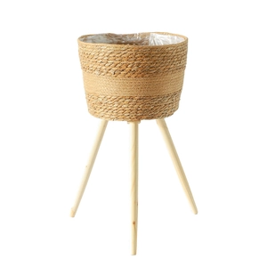 Nordic woven plant stand with natural grass basket and three light wood legs