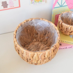 Detail view of woven water hyacinth plant baskets with waterproof plastic linings