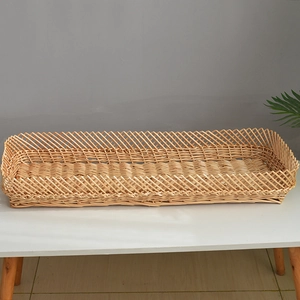 Detail of hand-woven wicker tray featuring cross-hollow mesh and rustic natural wood texture