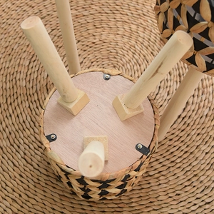 Handwoven rattan plant stand with tripod solid wood legs and reinforced metal components
