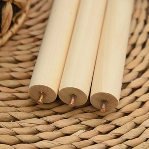 Close-up of three cylindrical wooden furniture legs with pre-installed metal screw rods
