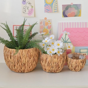 Close-up of the waterproof transparent plastic liner inside a woven grass plant basket