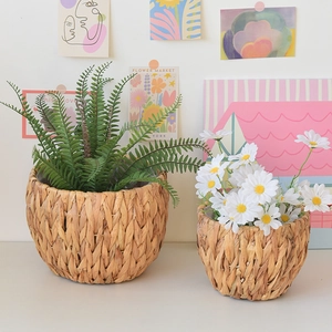 Detailed view of handmade woven water hyacinth plant baskets in two sizes for home decor