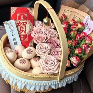 Handwoven basket with pink roses and red eggs for new baby gift set