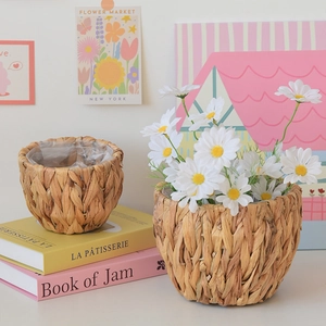 Detail view of woven plant baskets set with waterproof plastic liners and natural texture