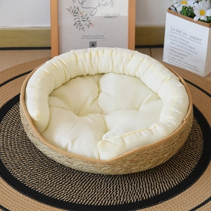 Detail shot of hand-woven cat nest with natural fiber frame and soft beige inner cushion