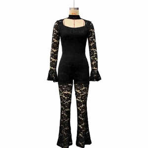 Detail of elegant black lace jumpsuit with flared sleeves and high neck choker collar