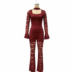 Close-up of wine red lace jumpsuit featuring hollow-out floral mesh and flared sleeves