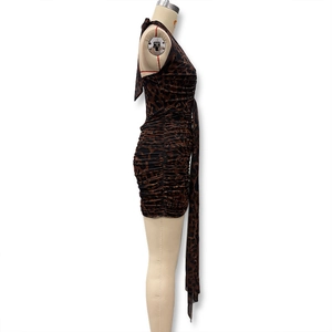 Detail of leopard print halter dress featuring side ruching and long strap ties