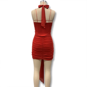 Detailed back view of a red ruched halter dress with elegant tassel hem on a mannequin