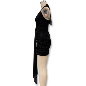 Detailed side view of black halter dress with ruched texture and long decorative ribbon