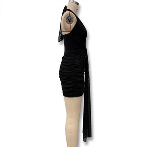 Detail of black halter bodycon mini dress featuring ruched fabric and sheer mesh streamers