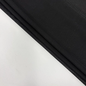 Detail shot of black breathable honeycomb mesh fabric texture for the backless dress