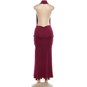 Macro view of burgundy backless halter maxi dress with high side slit on mannequin