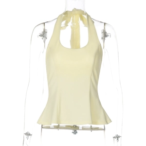 Detail of light yellow halter top with peplum hem and back tie-up design