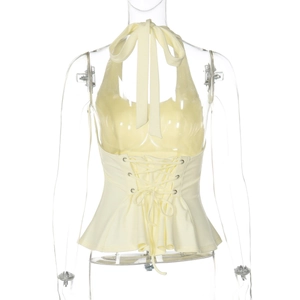 Close-up of the adjustable criss-cross tie-back detail on a yellow halter top