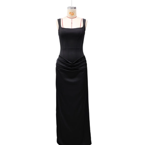 Detailed view of black square neck dress with corset stitching and waist pleats