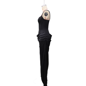 Detail view of the side profile showing draped pleats on a black slim fit dress