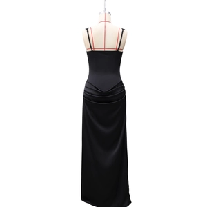 Detail of the elegant black satin evening dress with sophisticated back drape design