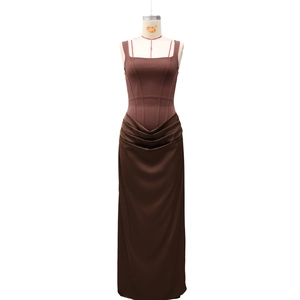 Close-up of brown sleeveless dress with square neckline and ruched waist detailing