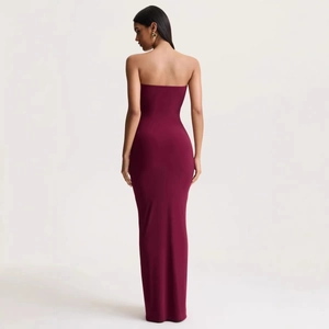 Elegant burgundy strapless floor-length evening dress with a slim fit and back detail view