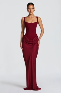 Detailed view of burgundy square neck gown with corset bodice and side pleats