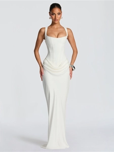 Detail showing the elegant draped ruching and structured corset bodice of the white maxi dress