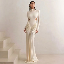 Detail view of beige bodycon gown with side cut-outs and pleated draping effect