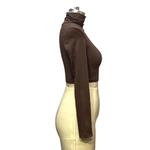 Side view of brown high-neck crop top showing slim fit cut and soft knitted texture