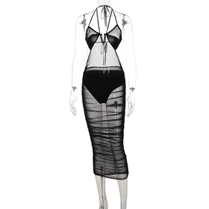 Close-up of ruched mesh detailing on sexy black halter neck see-through maxi dress