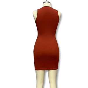 Detail of caramel sleeveless ribbed knit dress showing vertical texture and slim fit design
