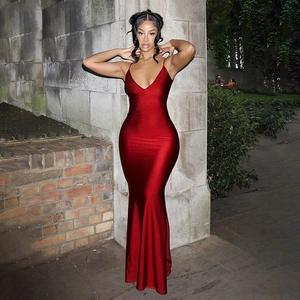 Detail of red deep V-neck mermaid dress with slim spaghetti straps and metallic fabric