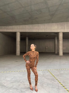 Detail view of the long sleeve leopard print bodysuit with slim fit and turtleneck design