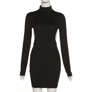 Detail view of the cut-out waist design on a black long sleeve mini dress