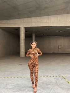 Detail of slim-fit leopard print long-sleeve bodysuit with mock neck and high stretch fabric