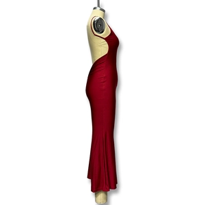 Detail of deep red backless evening dress with a fisheye silhouette and silk gloss finish