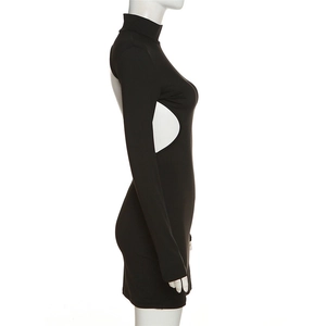 Detail view of black turtleneck mini dress with side cut-out and ribbed knit texture