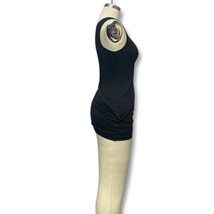 Side view of black slim fit sleeveless mini dress featuring ruched side detailing