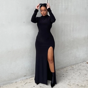 Detail of high-neck black evening dress showing long sleeves and high thigh slit cut