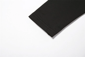 Detail shot of black knitted dress sleeve with durable double-needle stitching