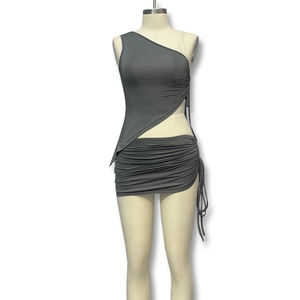 Detail of dark grey one-shoulder crop top and matching drawstring ruched mini skirt set